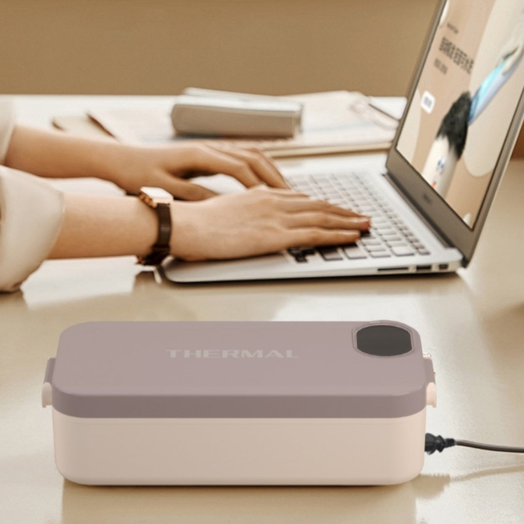 VitalHeat™ Cordless Heated Lunch Box in Elegant Gray beside a laptop