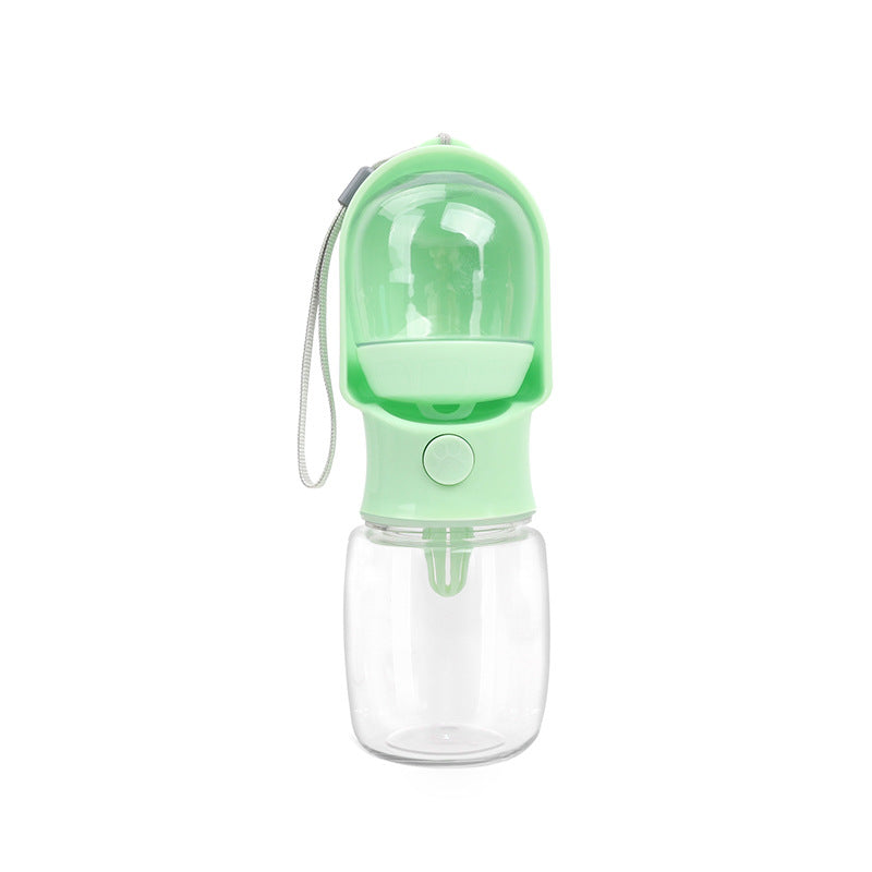 Green VitalGroom portable pet hydration and treat bottle with clear reservoir, integrated trough, and wrist strap