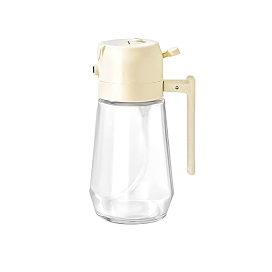 VitalHeat 2-in-1 glass oil sprayer and pourer with beige dispensing head, clear glass bottle, and integrated handle