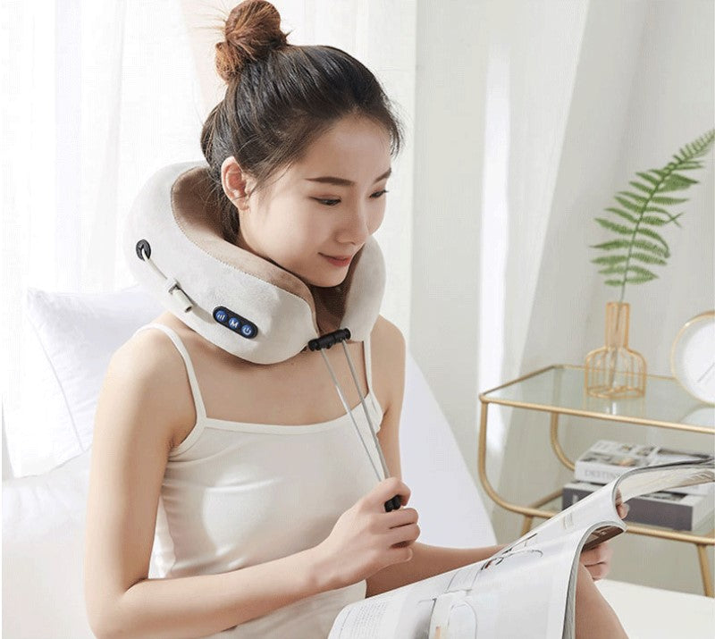 Woman wearing the VitalRelief™ Heated Kneading Neck Massager while relaxing at home