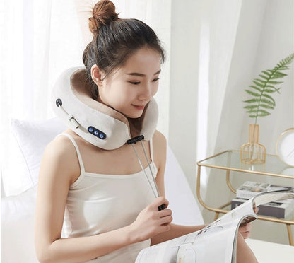 Woman wearing the VitalRelief™ Heated Kneading Neck Massager while relaxing at home