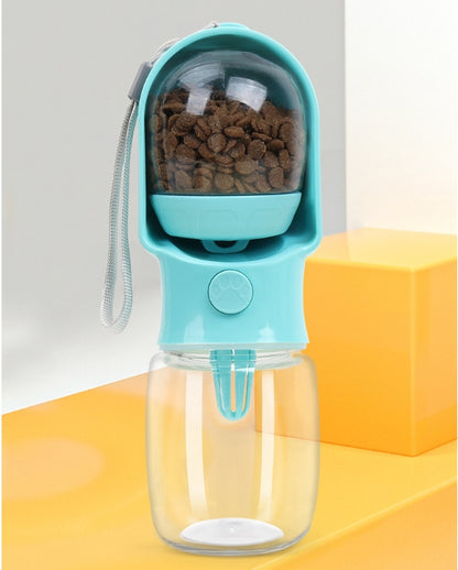 Blue VitalGroom portable pet hydration and treat bottle with dry treats visible in the removable upper compartment